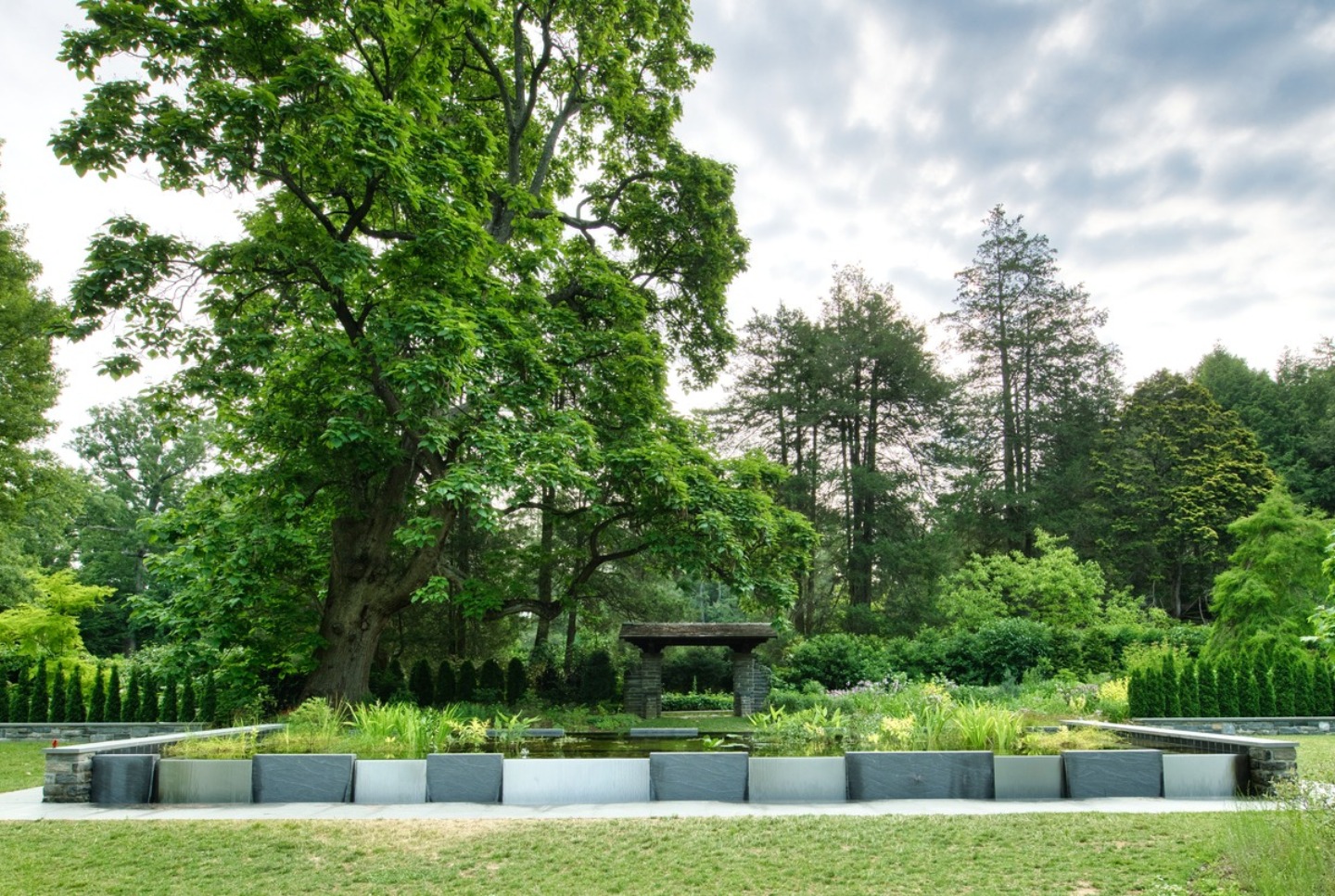 Decorative Water Feature at "Stoneleigh: A Natural Garden" in Lower Merion Township, Montgomery County, PA Alta provided Structural Engineering and Plumbing Design services for this project. Concept and construction by PondWorks.